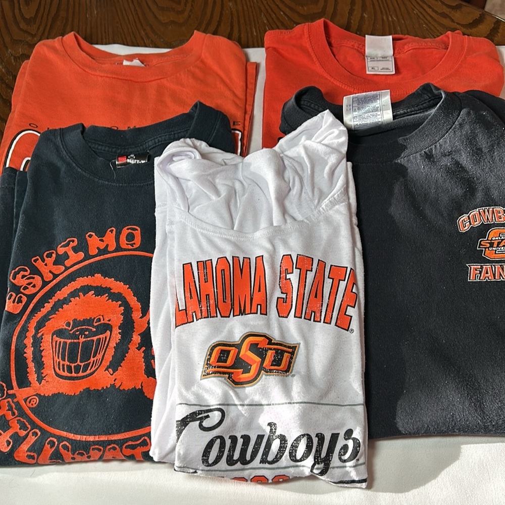 5 Oklahoma State University T-shirts. 3/L &  2 XL. I think 3 are XL 2 L.